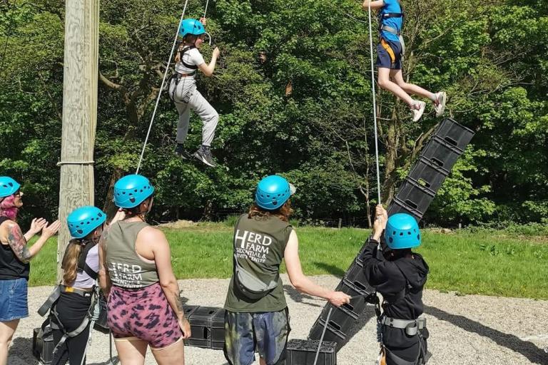Children playing on a crate climbing activity.