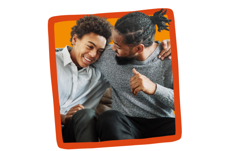 A foster carer embraces his teenage foster child.